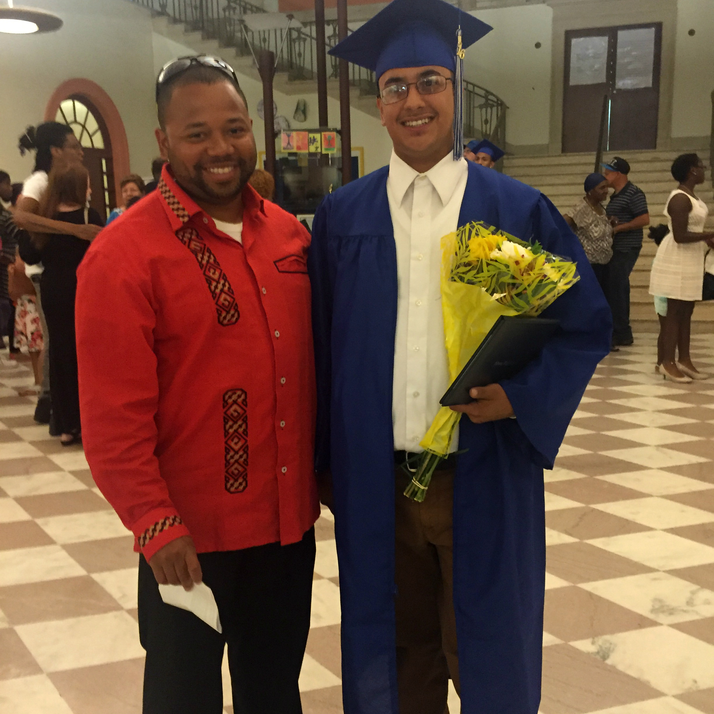 Elijah and a YOUTH POWER! constituent at a graduation