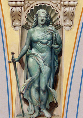 This Lady Justice along with figures depicting Clemency, Authority and Judgement, decorate the pendentives supporting the dome inside the entrance of the courthouse. It opened in 1927, but it was not until 1934 that funding for the building's murals was provided by the Works Progress Administration (WPA). Attilio Pusterla was retained for the interior art work, including the important mural History of the Law which graces the building's great dome. A major conservation was completed in the early 1990s, and, thankfully, these significant works of art are once again pristine.