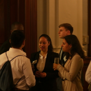 Young lawyers network at a program reception.