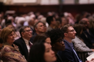 The audience listens intently to a Society program.